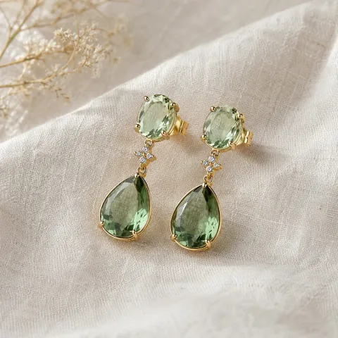 Matching gemstone drop earrings on pale linen