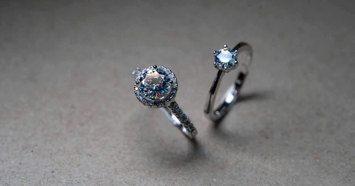 Two silver diamond rings photographed in close-up
